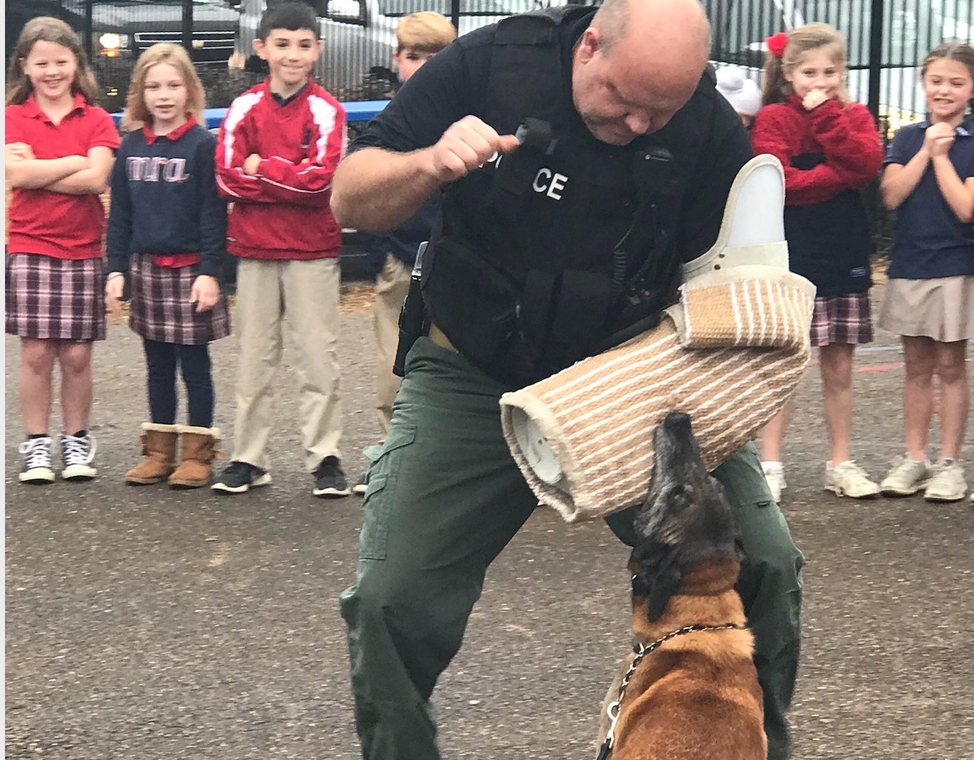 Madison K-9 Officer Paul Bunch seen with K-9 Maxx at a past demonstration at Madison-Ridgeland Academy.
